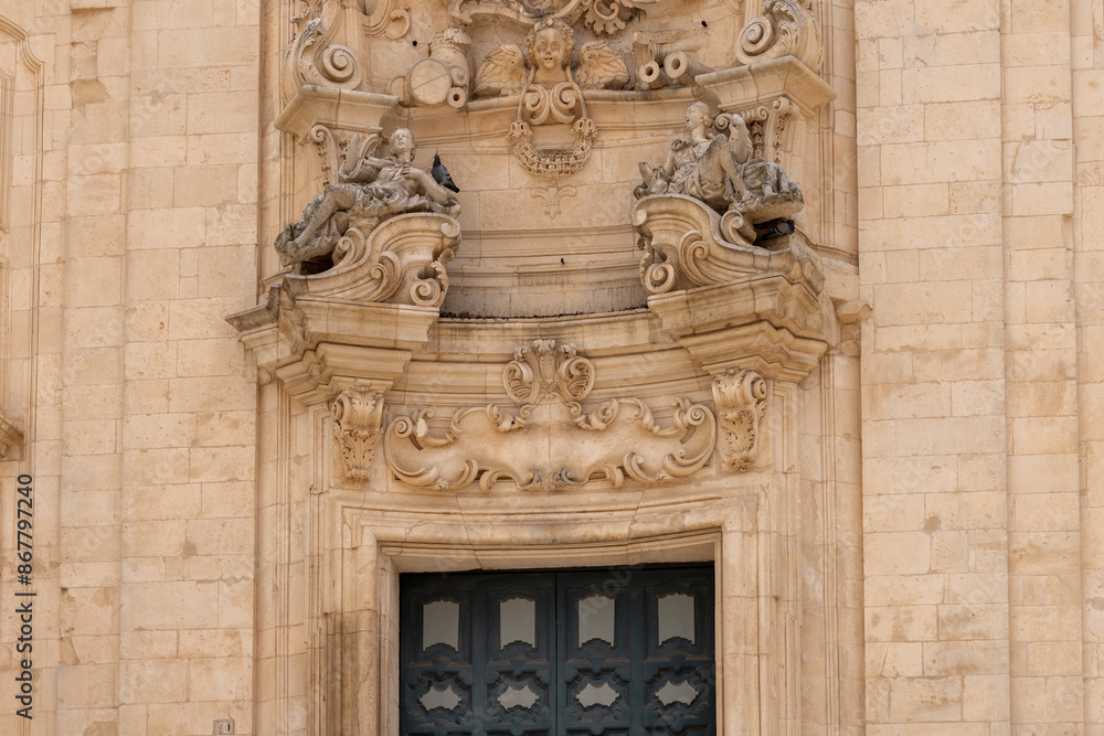 Facade of baroque Basilica of San Martino (Basilica di San Martino), located in Plebiscito Square, Martina Franca, Italy, Apulia