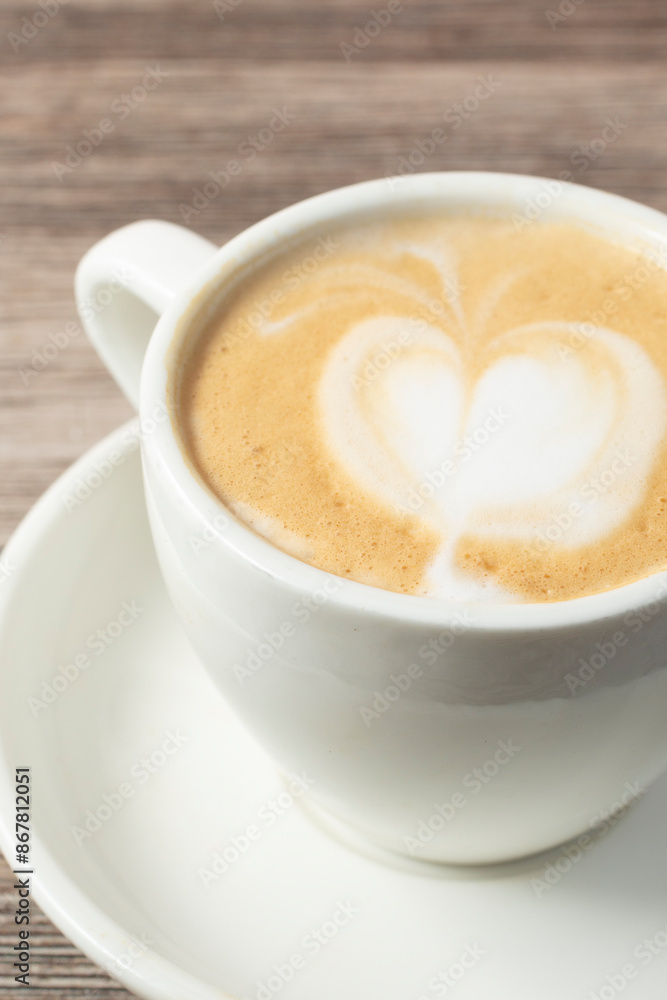 A closeup view of a small mug of cortado. A closeup view of a small mug of cortado.