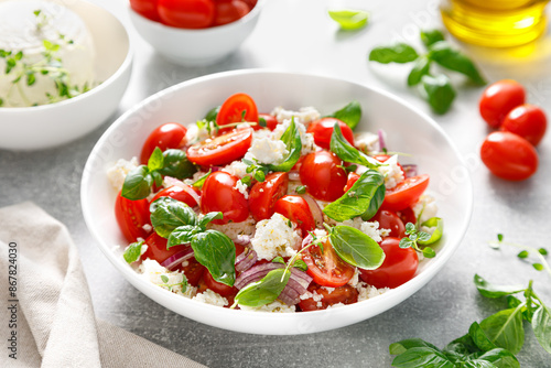 Salad of tomato, ricotta cheese and basil