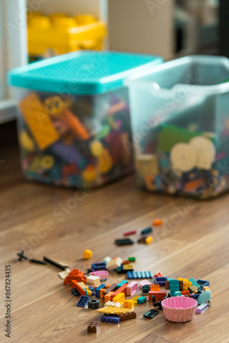 Organizing children blocks. Child programming concept. Cleaning playroom or classrom. Sorting the blocks. photo