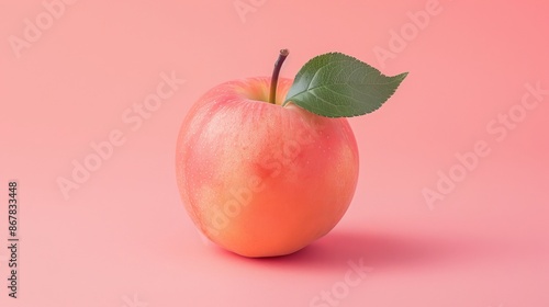 A clear image of a fresh, ripe apple with a single green leaf set against a pink background, representing simplicity, health, and freshness, ready to be consumed.