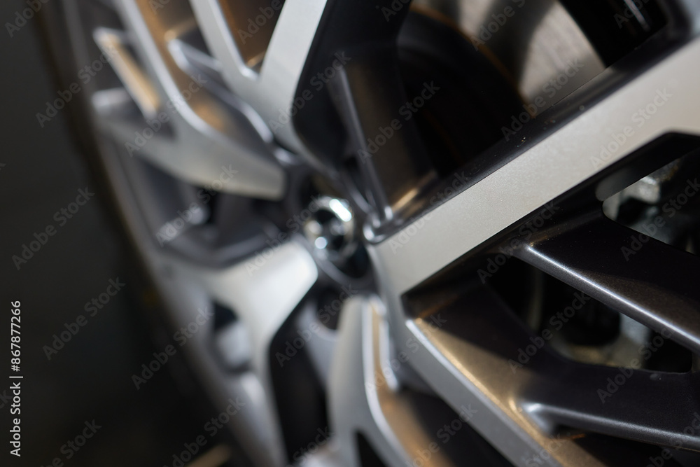 Closeup of a modern car wheel with alloy rims showcasing stylish design and craftsmanship Closeup of a modern car wheel with alloy rims showcasing stylish design and craftsmanship