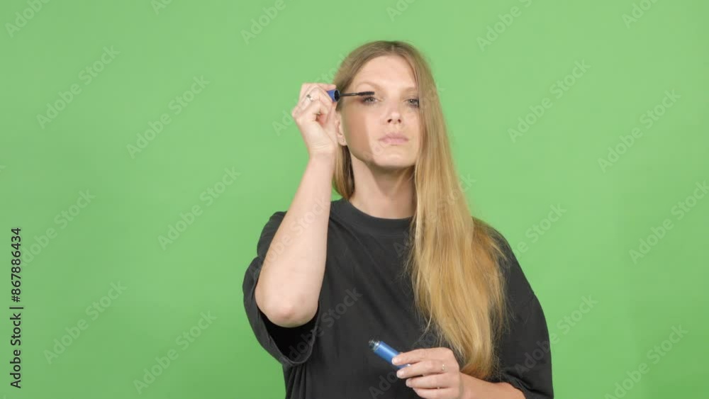 Eye lashes makeup, a woman applying mascara on lashes. Green screen Eye lashes makeup, a woman applying mascara on lashes. Green screen
