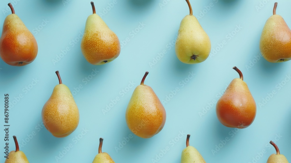 Pears pattern on light blue background, top view. Fresh fruit arrangement concept