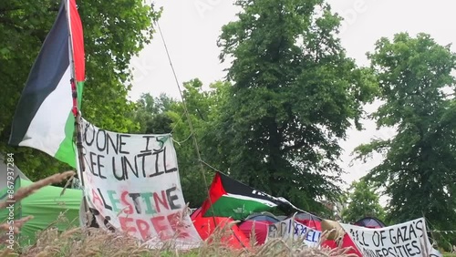 Students protesting peacefully for the Palestine-Israel conflict on the University of Bristol's campus. Flags and banners wave in the wind at the Palestine solidarity camp at Bristol University.