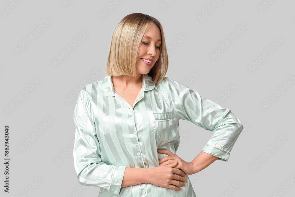Happy young woman with bob hairstyle on grey background Happy young woman with bob hairstyle on grey background