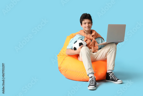 Teenage boy with soccer bal...