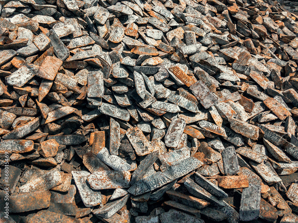 Cast iron ingots are stored in a warehouse. The shape of cast iron: ingots, ingots in a solid state. Transfer cast iron is cast iron used for further processing into steel. Cast iron ingots are stored in a warehouse. The shape of cast iron: ingots, ingots in a solid state. Transfer cast iron is cast iron used for further processing into steel.
