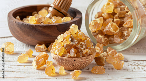 Frankincense resin with essential oil on white background