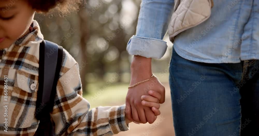 Child, mother and holding hand with walk in park for love, care or support at outdoor nature. Closeup of young mom, little boy or kid with backpack or bag for childhood, youth or safety at park Child, mother and holding hand with walk in park for love, care or support at outdoor nature. Closeup of young mom, little boy or kid with backpack or bag for childhood, youth or safety at park