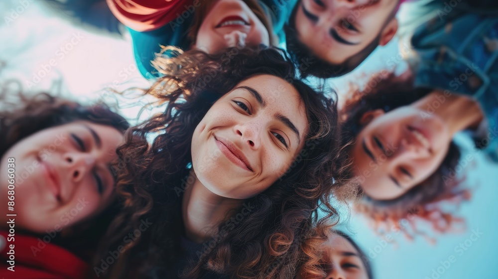 A group of people are smiling and posing for a picture A group of people are smiling and posing for a picture