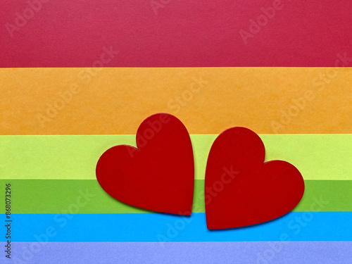 Free Download Wooden red heart shaped with multicolored background. Known for LGBT symbol. Stock photo. - GFXLoad