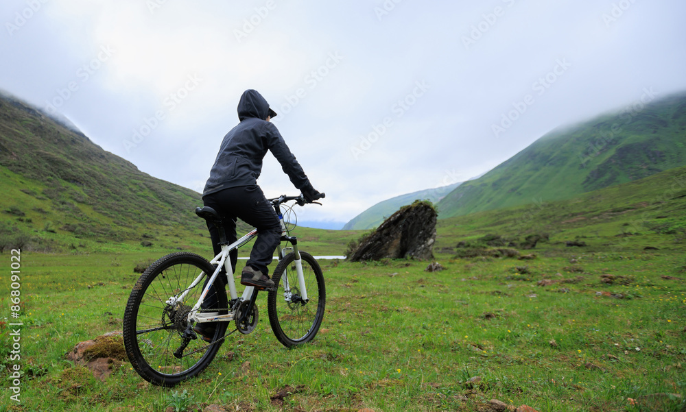 Fototapeta premium Riding mountain bike in the beautiful mountains