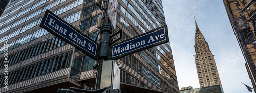 street signs and skyscraper in new york city
