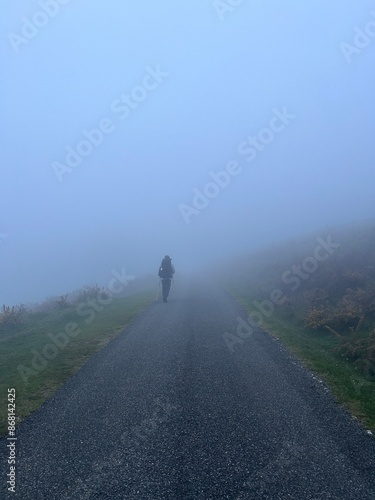 Person walking in the mist