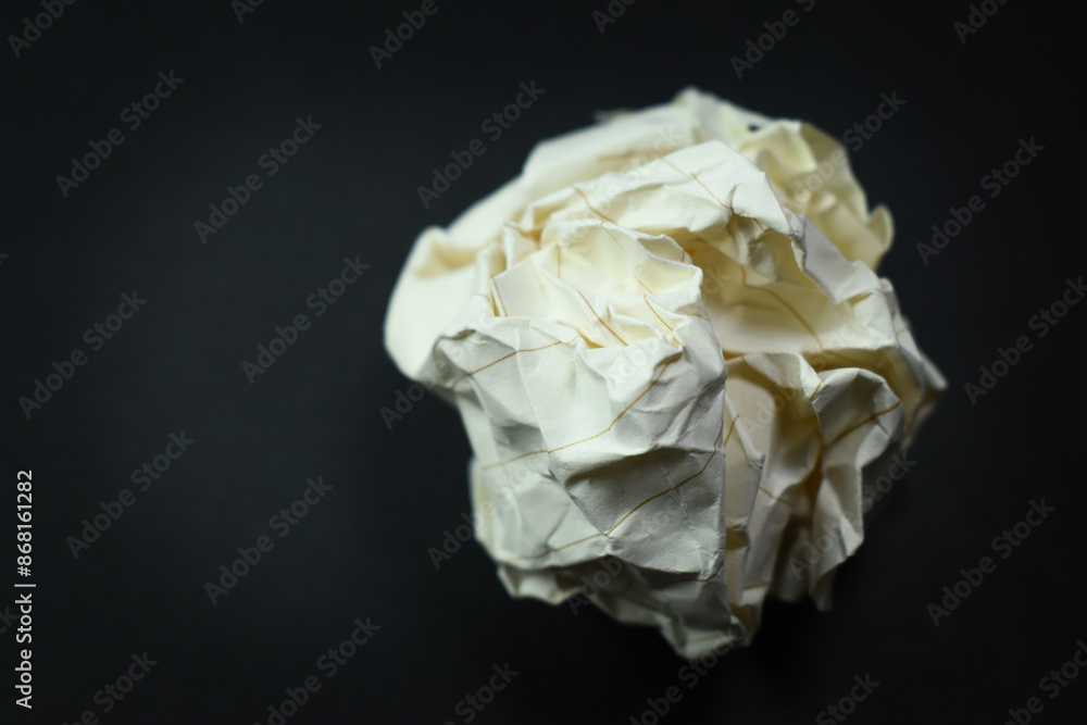 round lump paper on black background, recycle used paper round lump paper on black background, recycle used paper