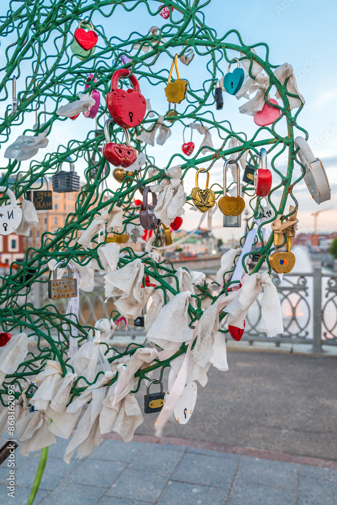 Fototapeta premium Decorative tree decorated with ribbons and locks