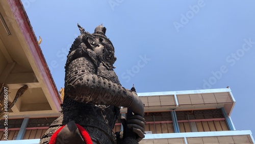 Thao Wessuwan statue is the god of wealth,the rich,and fortune,Wat Suttharam,Buddhist temple in Bangkok.Large giant guard. photo