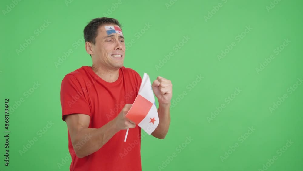 Nervous man cheering for Panama during a match looking away Nervous man cheering for Panama during a match looking away