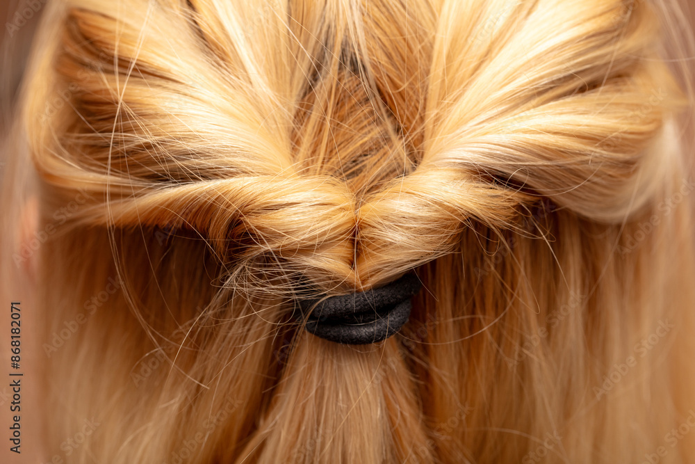 Naklejka premium Braids on a woman's head. Close-up