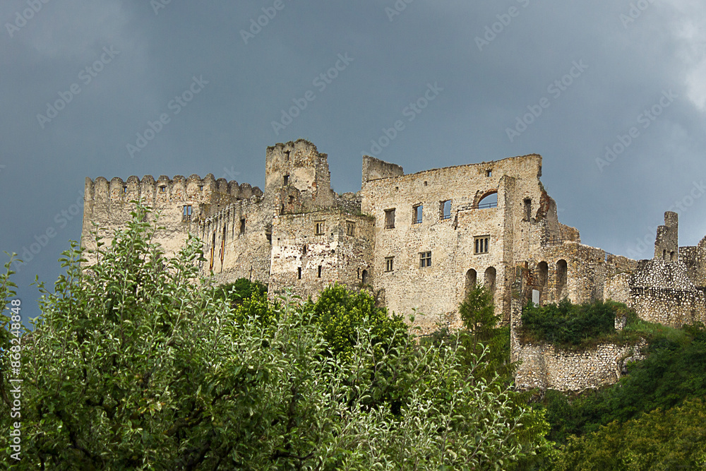 The ancient 12th century Beckov Castle in Slovakia. Landscape with a medieval castle on top of a mountain. The ancient 12th century Beckov Castle in Slovakia. Landscape with a medieval castle on top of a mountain.