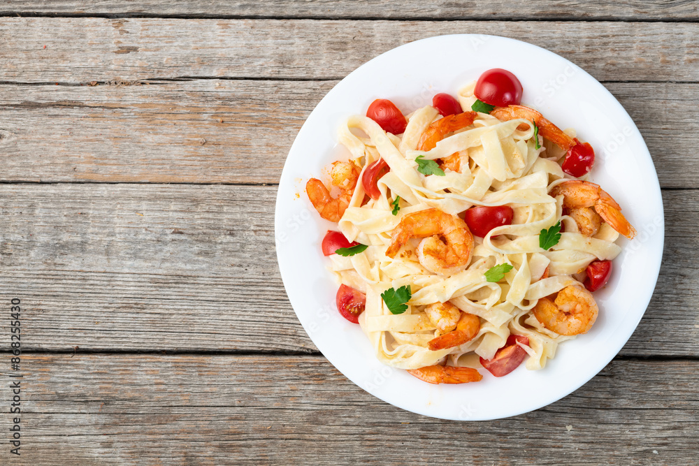 Italian pasta with shrimps , parmesan and tomatoes Italian pasta with shrimps , parmesan and tomatoes