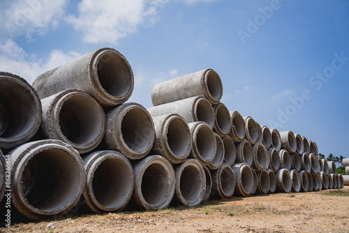 A stack of concrete ring pipes piled and creating a symmetrical arrangement © romaset