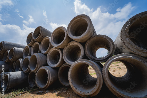 A stack of concrete ring pipes piled and creating a symmetrical arrangement © romaset