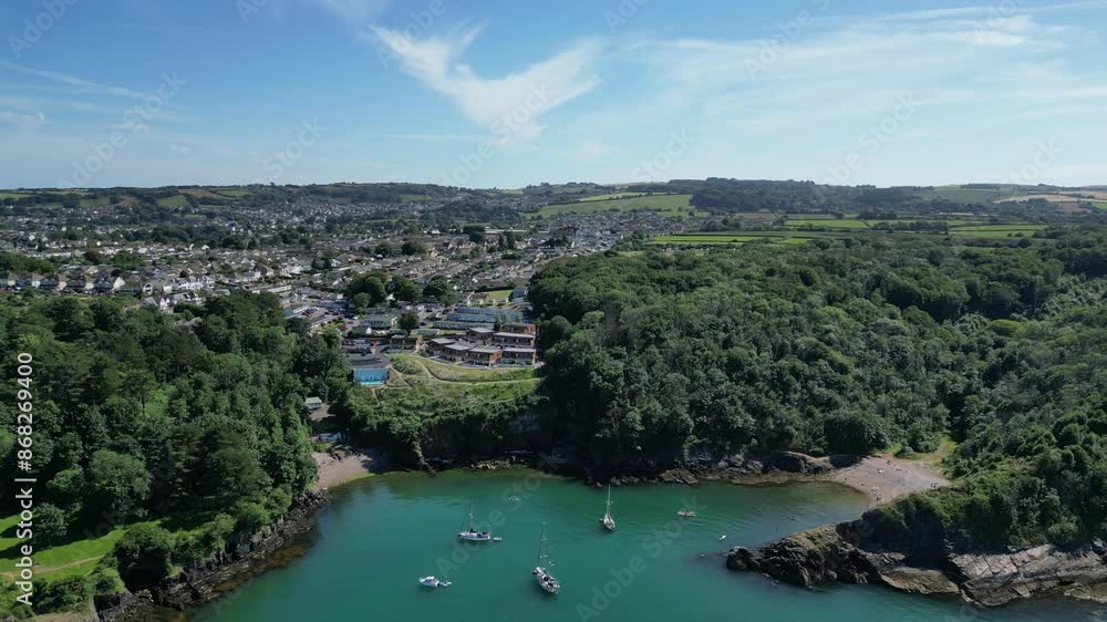 Brixham, Torbay, South Devon, England: DRONE VIEWS: Churston Cove (far right) and Fishcombe Cove. The coves are located close to Brixham, a popular UK holiday destination and fishing port (Clip 2). Brixham, Torbay, South Devon, England: DRONE VIEWS: Churston Cove (far right) and Fishcombe Cove. The coves are located close to Brixham, a popular UK holiday destination and fishing port (Clip 2).
