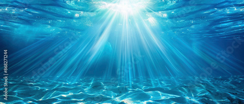 Sun shining light in blue clearly deep water, sunbeams illuminate the blue underwater sea scene, background 