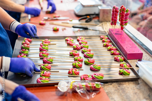 making colorful lollipops on a stick