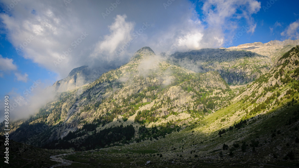 Fototapeta premium Morning fog in the Cavallers reservoir (Boí Valley, Aigüestortes i Estany de Sant Maurici National Park, Catalonia, Spain, Pyrenees)