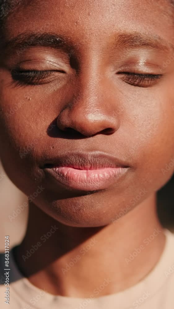 A girl with her eyes closed against the background of nature A girl with her eyes closed against the background of nature