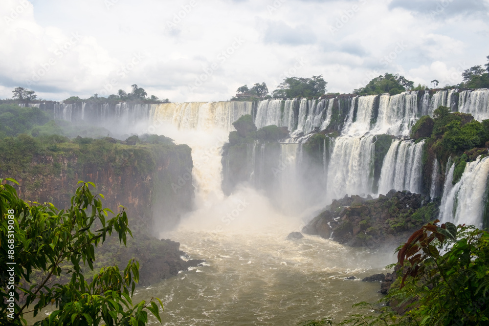 Tropical landscape with falls ending in the river at the Iguazu Falls in Argentina Tropical landscape with falls ending in the river at the Iguazu Falls in Argentina
