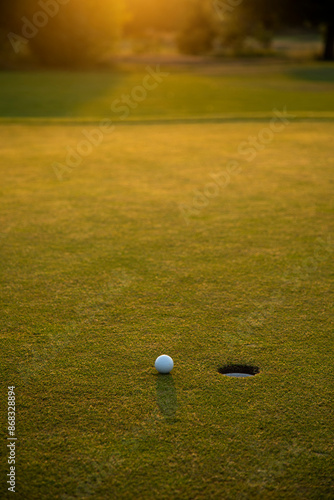 Closeup Golf ball on green grass on course, Sport and lifestyle
