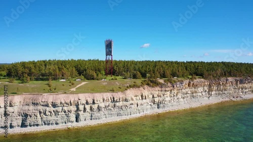 4K panoramic aerial video from flying drone to Panga coastal cliff and lighthouse , northern shore of Saaremaa island, near Kuressaare, Baltic Klint.Saaremaa , Estonia photo