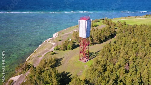 4K panoramic aerial video from flying drone to Panga coastal cliff and lighthouse , northern shore of Saaremaa island, near Kuressaare, Baltic Klint.Saaremaa , Estonia photo