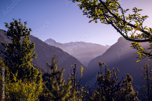 Sunrise over the mountains. Rising sun in the hills of Himalayan village Raila, Himachal Pradesh, India.
 photo