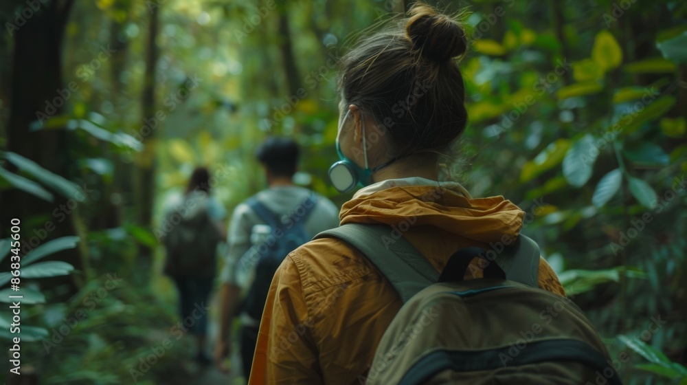 Fototapeta premium Group of Friends Hiking Through Lush Forest, Emphasizing Adventure and Health Protection