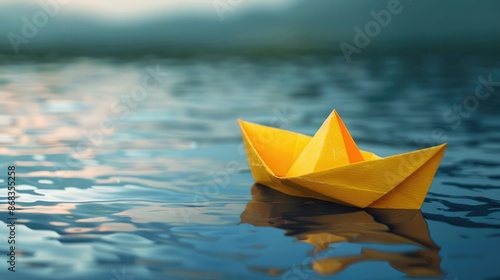 Yellow paper boat afloat on the water