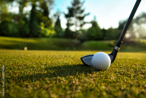 Closeup Golf ball on green grass on course, Sport and lifestyle