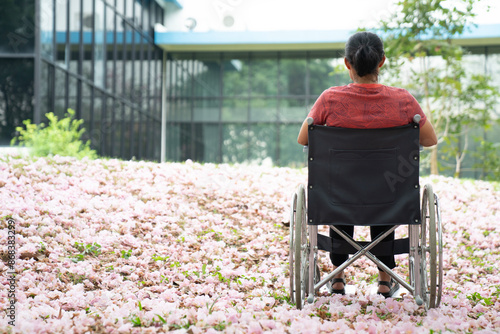 woman using a wheelchair in thje hospital. photo