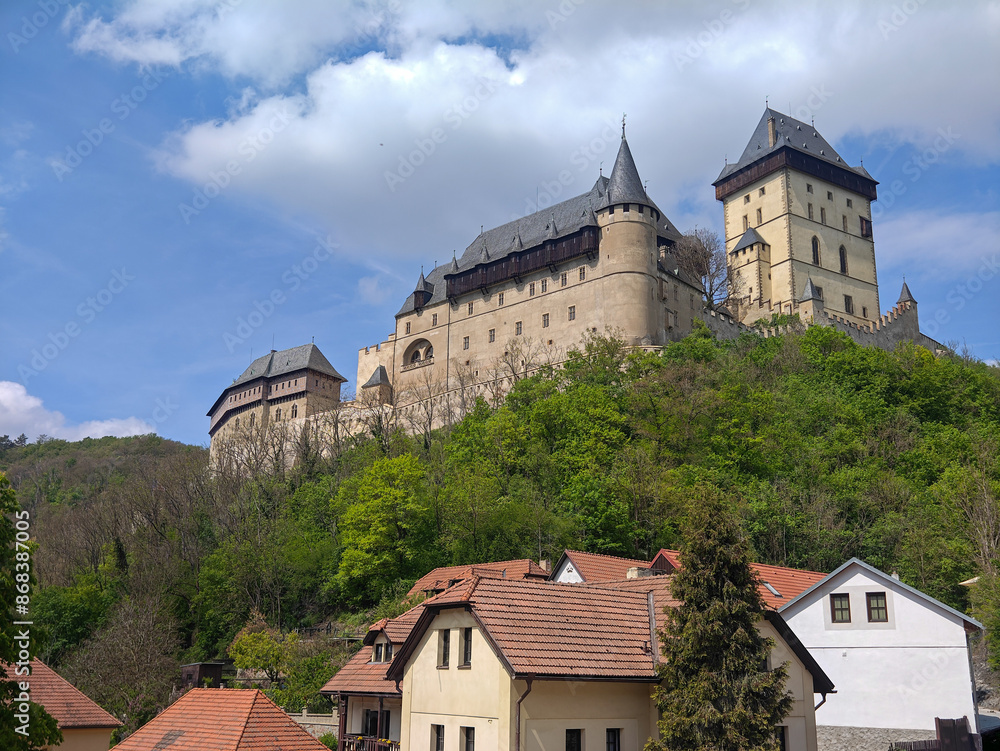 view of Karlstejn Castle against sky on sunny day, Karlstejn, Beroun District, Central Bohemian Region, Czech Republic view of Karlstejn Castle against sky on sunny day, Karlstejn, Beroun District, Central Bohemian Region, Czech Republic