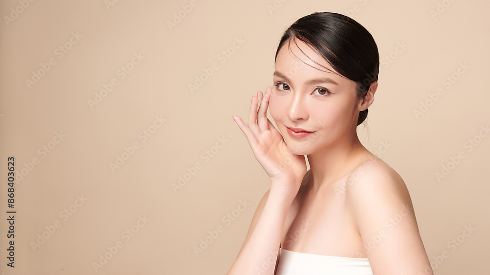 Beautiful young asian woman with clean fresh skin on beige background, Face care, Facial treatment, Cosmetology, beauty and spa, Asian women portrait. Beautiful young asian woman with clean fresh skin on beige background, Face care, Facial treatment, Cosmetology, beauty and spa, Asian women portrait.