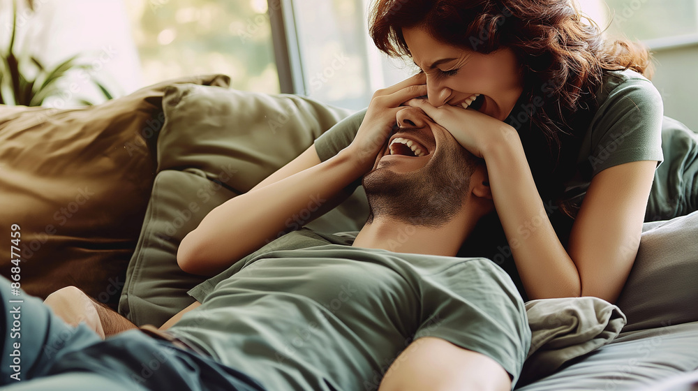 Two people, one covering the other's eyes Two people, one covering the other's eyes