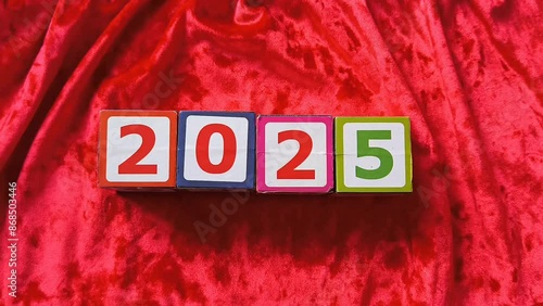 top view kids cubes with 2025 number lay on the red background, New year symbol