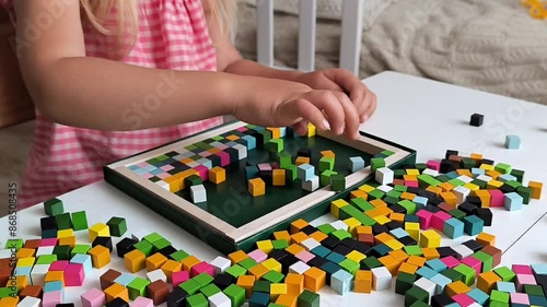 little girl play wooden blocks constructor, wooden mosaic