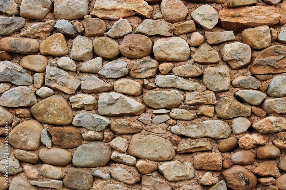 Stone wall in an old abandoned and ruined house Stone wall in an old abandoned and ruined house