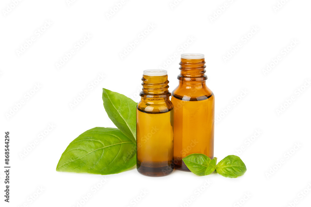 Basil essential oil isolated on white background. Basil essential oil and fresh leaves. Aromatherapy. Aroma oil. Medical herbs. Alternative medicine. Place for text. Copy space. Basil essential oil isolated on white background. Basil essential oil and fresh leaves. Aromatherapy. Aroma oil. Medical herbs. Alternative medicine. Place for text. Copy space.