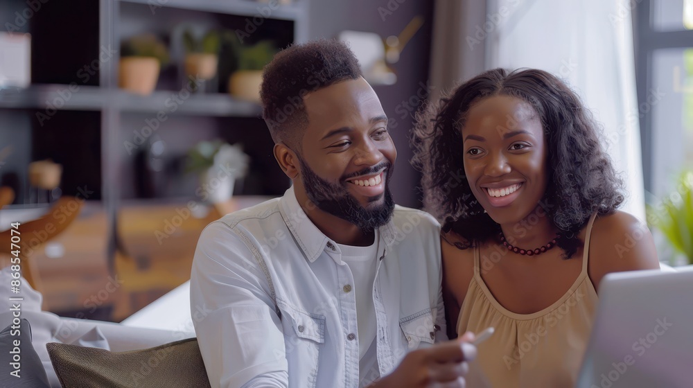 Happy couple meeting with their real estate agent in a beautifully decorated office, excitedly discussing their future home options Happy couple meeting with their real estate agent in a beautifully decorated office, excitedly discussing their future home options